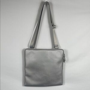 Urbanoxide Silver Crossbody Bag. 12 inches wide, 12‎ inches tall, 1 inch width.